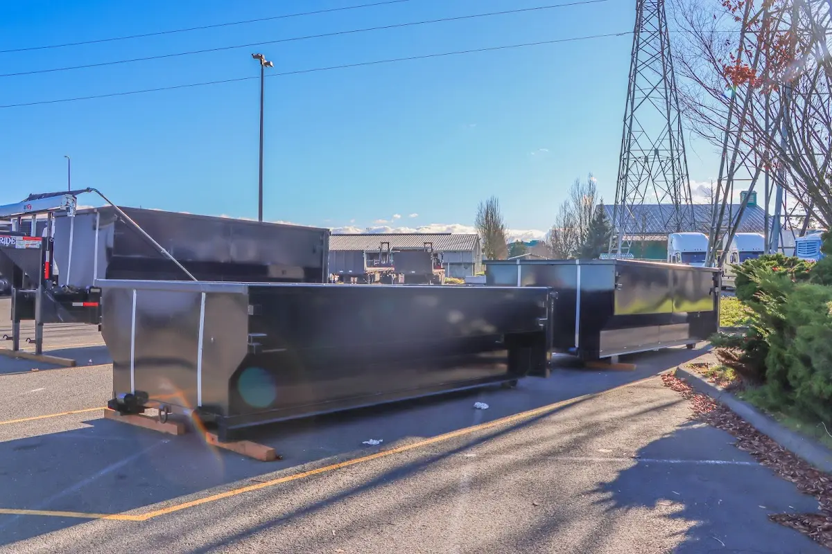 Roll-off dumpster ready for waste disposal at job site for 12 Yard Dumpster Rental in Menomonie